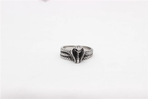 Macro detail of vintage snake ring showing intricate scales and cobra head in aged silver