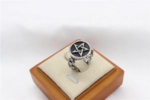Detail of vintage star ring featuring chain-link band and antique silver finish