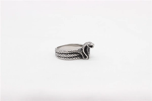 Macro detail of retro silver snake ring with textured scales and punk snake head design
