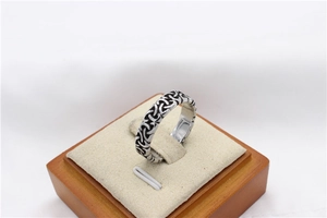 Macro view of vintage silver Celtic knot steel ring with black oxidized details