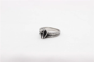 Macro detail showing vintage silver cobra snake scale texture on stainless steel ring