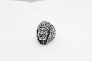 Close-up of vintage steel Indian chief ring showing detailed feathers and oxidized finish