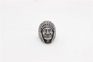 Macro shot of retro Indian chief head ring with detailed feather headdress engraving