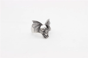 Macro shot of vintage bat ring wings detail in antique silver stainless steel