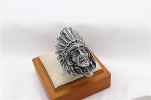 Close-up of vintage steel ring featuring detailed native American chief with feather headdress