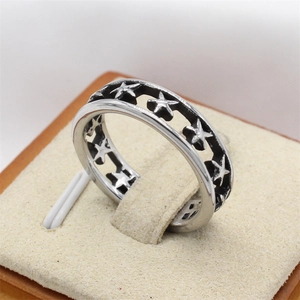 Retro hollow star titanium steel ring for men with vintage industrial finish and detail