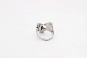 Detailed view of silver gothic bat ring showing intricate wing textures and wide metal band