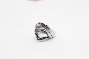 Macro detail of retro shark head steel ring with oxidized silver finish and gothic carving