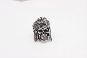 Detailed view of retro Indian skull ring with intricate feather headdress carving