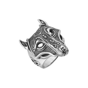 Detailed close-up of a vintage viking wolf head ring with intricate celtic carvings
