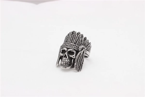 Macro shot of retro stainless steel Indian skull ring with detailed feather craftsmanship