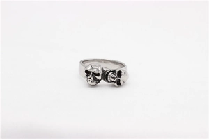 Detailed macro view of vintage silver double skull ring with gothic punk texture