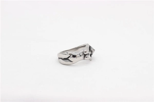 Detailed view of vintage Medusa sculpture on silver-tone stainless steel ring