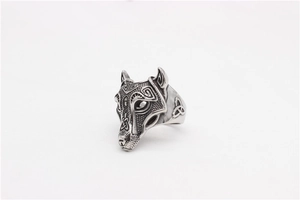 Macro shot of retro stainless steel wolf head ring with celtic knot engravings