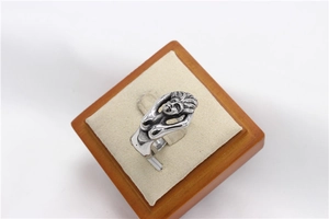 Macro view of the retro silver woman sculpture design on the titanium steel ring