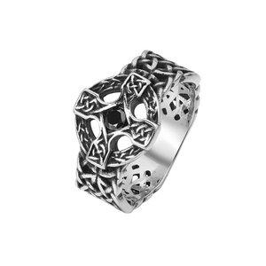 Detail of vintage gothic titanium steel ring featuring a black gem and Celtic cross