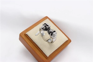 Macro detail of retro punk skull ring in silver stainless steel with vintage black finish