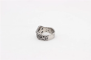 Detailed close-up of retro silver cross ring with intricate hollow celtic knot pattern