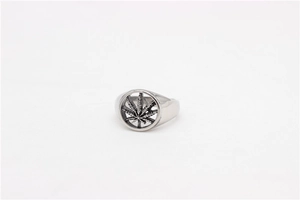 Macro view of retro stainless steel ring featuring a hollowed-out maple leaf design