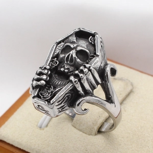 Gothic silver coffin ring with skull and bone claws in vintage punk stainless steel