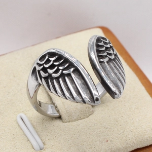 Retro stainless steel angel wing ring for men featuring detailed feather carvings