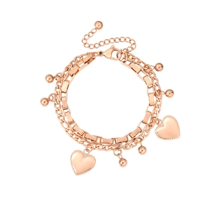 Double-layered rose gold bracelet with heart charms and small beads on white surface