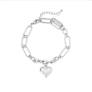 Close-up of a silver heart charm on a paperclip link chain with adjustable clasp