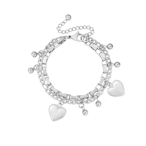 Detail of double-layer stainless steel bracelet with textured heart charms and lobster clasp