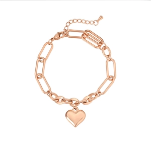 Detail view of rose gold chunky link bracelet featuring a polished heart pendant charms