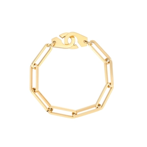 Macro detail of gold link bracelet with distinctive handcuff design clasp on white backdrop