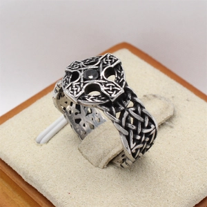 Retro stainless steel ring featuring a Celtic cross and a black center stone gemstone