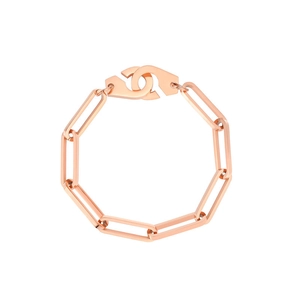 Detailed macro of rose gold paperclip chain bracelet with interlocked handcuff clasp