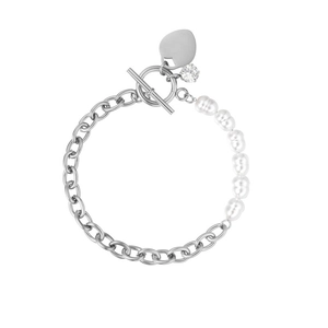 Detail of toggle clasp bracelet with baroque pearls and heart pendant on silver chain