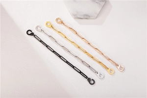 Detailed view of titanium steel link bracelets in black, silver, gold and rose gold colors
