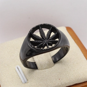 Retro black titanium steel ring featuring a hollowed-out maple leaf design for punk style