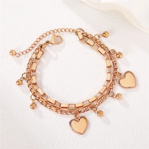 Elegant rose gold double-layer chain bracelet with heart pendants and metal beads