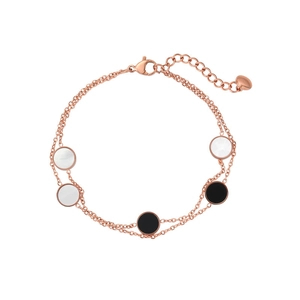 Close-up of rose gold double-layer bracelet with black and white shell round charms