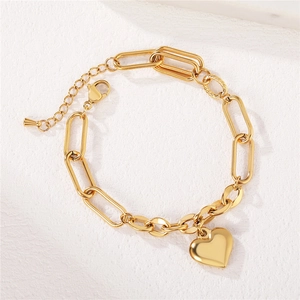Minimalist gold titanium steel chain bracelet with smooth heart pendant on white background