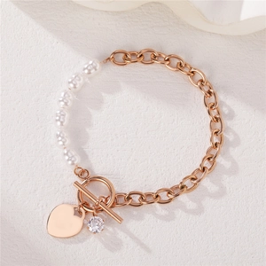 Minimalist OT toggle bracelet with heart pendant and pearls in rose gold finish