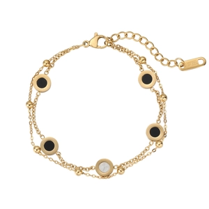 Bracelet double couche en acier doré avec breloques rondes en nacre noire et blanche