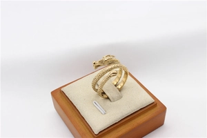 Detailed close-up showing the golden dragon scale textures on this vintage men's steel ring