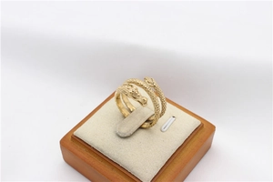 Close-up of golden dragon ring showing intricate scale textures and detailed dragon head