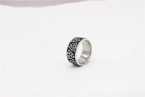 Detailed close-up of retro Viking Valknut symbol engraved on wide stainless steel ring band