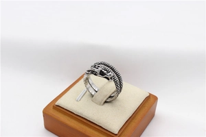 Detailed view of vintage Chinese dragon ring with intricate scales and steel texture