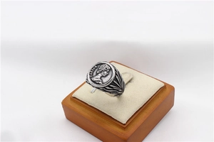 Detail of vintage Caesar portrait relief on retro silver textured coin ring