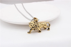 Detailed close-up of a roaring golden lion pendant necklace with vintage texture details