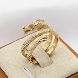 Golden vintage dragon ring with intricate scale texture and detailed head design