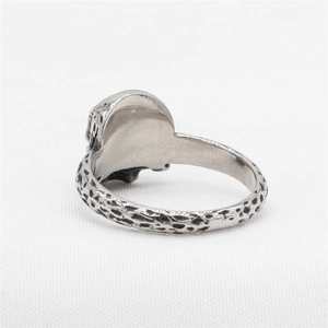 Retro stainless steel skull ring featuring a textured hammered finish and vintage silver look