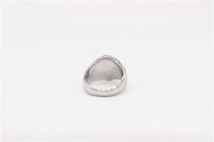 Macro detail of the smooth polished silver band showing the thick back of a steel ring