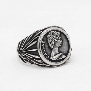 Vintage silver David coin ring featuring Caesar relief and feather texture on the band